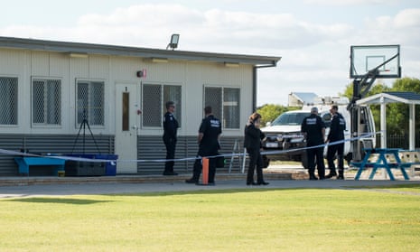 Police inspect a classroom that was hit with two rounds from a gun allegedly fired by a 15-year-old boy at Atlantis Beach Baptist College in Perth.