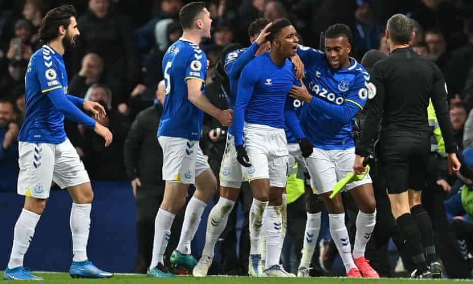 Everton’s Demarai Gray (second from left) is congratulated for his stoppage-time winner against Arsenal