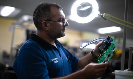 Zeeshan Malik tests printed circuit boards at the Siemens plant.