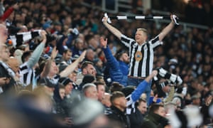 Newcastle fans celebrate.