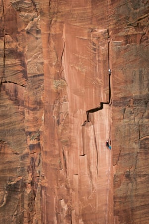 Climbers on the sheer face of the Moonlight Buttress in Zion national park, Utah.