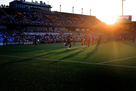 The sun sets behind the grandstand in the new RIFC stadium as the club takes on Loudoun United FC on August 9, 2025. Rhode Island Football Club, in its second year of existence, plays in the brand-new soccer-specific Centreville Bank Stadium, a 10,000 seat-plus venue which fosters a wildly enthusiastic crowd of supporters.