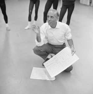 Jerome Robbins (1918 - 1998) kneels on the floor and smokes a cigarette as he rehearses a dance piece called ‘N.Y. Export, Opus Jazz,’ with his company, Ballets: U.S.A., for an appearance on the television variety program, ‘The Ed Sullivan Show,’ New York, New York, November 23, 1959.