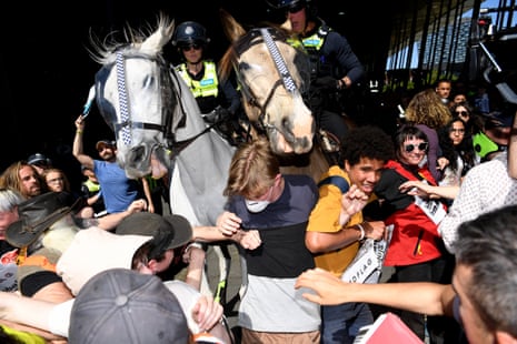 Environmental protesters clash with police outside the Melbourne Exhibition and Convention Centre where the 2019 Imarc conference was to be held.
