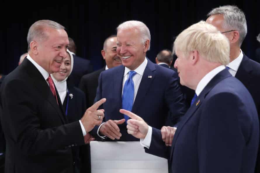 Boris Johnson (right) and the Turkish president Recep Tayyip Erdogan pointing fingers at each other at the Nato summit, as Joe Biden, the US president, looks on.