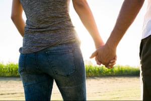 Couple holding hands taking walk together