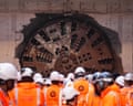 HS2 workers watch a boring machine breaking through at Washwood Heath depot near Birmingham, 9 May 2025