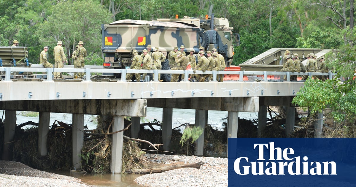Towns cut off by Queensland floods warned against panic-buying as premier vows ‘resilient’ rebuild | Queensland Towns cut off by Queensland floods warned against panic-buying as premier vows ‘resilient’ rebuild | Queensland