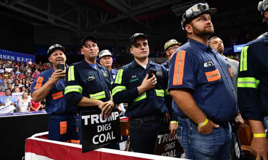 Supporters of of Donald Trump wearing mining gear attend a rally in Charleston, West Virginia, in 2018.