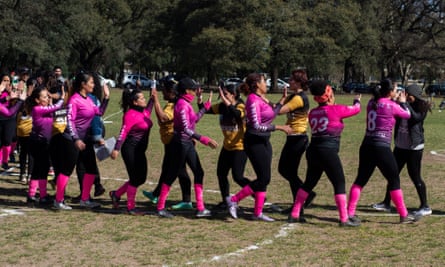 The kickingball teams greet one other before the game begins