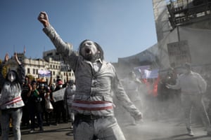 A man dressed as a zombie wearing a presidential sash demonstrates in San Martin Square on 14 November