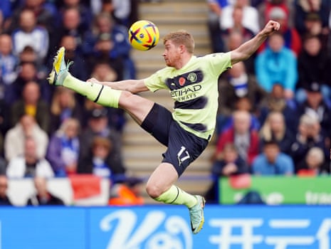 Manchester City's Kevin De Bruyne attempts to control the ball in the air.
