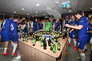 The Chelsea team celebrate victory in the changing room after the UEFA Europa League final.