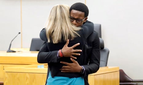 Botham Jean’s younger brother Brandt Jean hugs former Dallas police officer Amber Guyger after delivering his impact statement to her following her 10-year prison sentence for murder at the Frank Crowley Courts Building in Dallas, Texas, U.S. October 2, 2019. Tom Fox/Pool via REUTERS MANDATORY CREDIT TPX IMAGES OF THE DAY