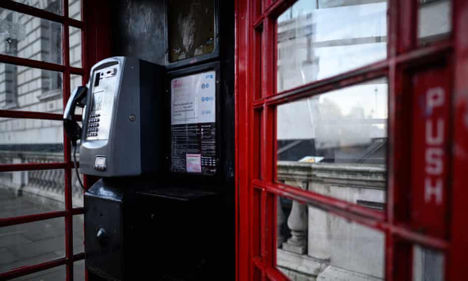 The interior of a traditional red telephone box in November 2021 in London