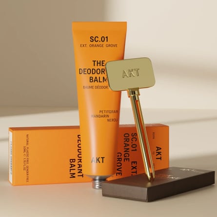 A tube of Akt deodorant, the key to use with the tube and its packaging.