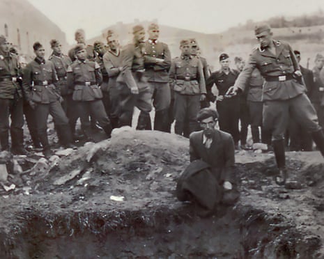 Historian uses AI to help identify Nazi in notorious Holocaust murder image | Second world war | The Guardian