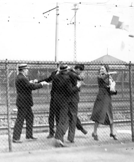 men clash with other people, appearing to shove or grab them
