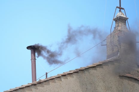 Black smoke billows from the chimney of the Sistine Chapel during the conclave to elect a new pope.