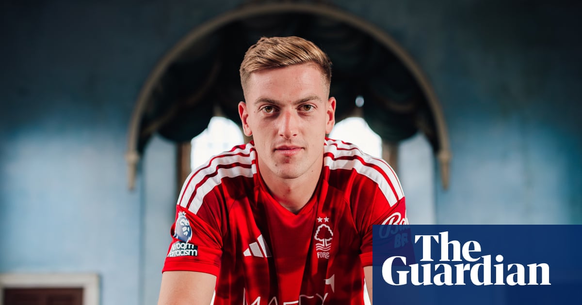 Liam Delap holding a Nottingham Forest shirt after completing his five-year contract signing