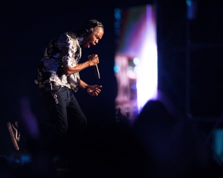 He sings plaintively into his microphone