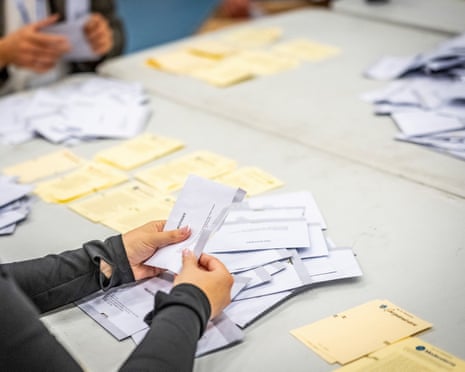 Voting envelopes are opened as the counting of votes takes place at the polling station at Kockums Fritid in Malmö.