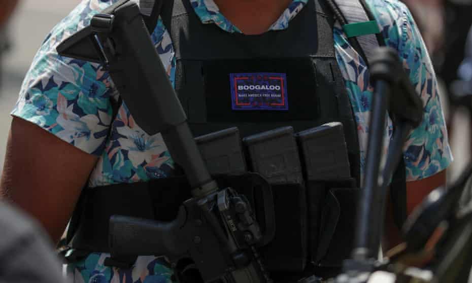 An armed protester wearing a Hawaiian shirt and a ‘boogaloo’ badge at a rally for second amendment gun rights near the state capitol in Richmond, Virginia, 4 July 2020. 