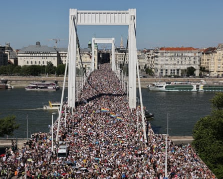 People marching over a bridge in Budapest
