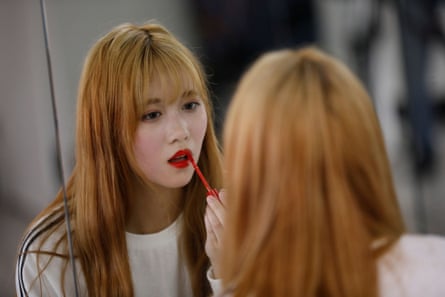 Yuho Wakamatsu adjusts her makeup during a training session in Seoul