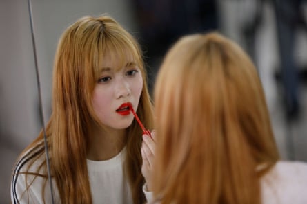 essay kpop Yuho Wakamatsu adjusts her makeup during a training session in Seoul