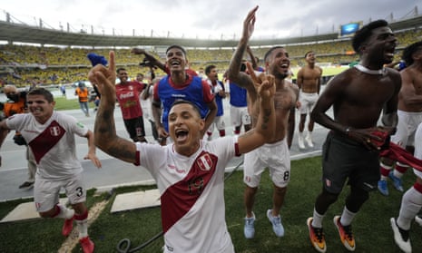 Peru’s players celebrate in front of their fans after a dramatic victory in Barranquilla