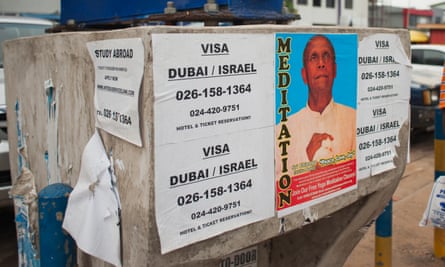 A flyposter advertising visa services in Accra.