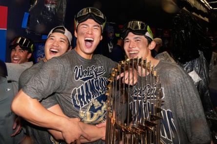 Los Angeles Dodgers pitcher Shohei Ohtani, pitcher Yoshinobu Yamamoto and pitcher Rōki Sasaki celebrate Saturday’s win.