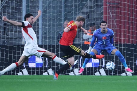 Kevin De Bruyne slots the ball home to give Belgium the lead in their Nations League match against Turkey.