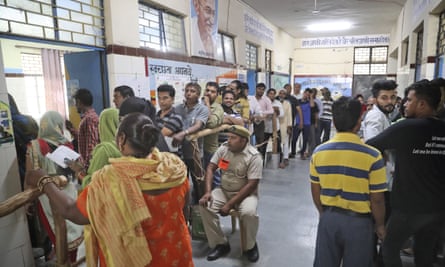 Indians wait to cast their votes in New Delhi on 12 May.