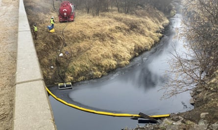 A remediation company deploys a dam on the surface of an oil spill after the Keystone Pipeline leaked into Mill Creek in Washington County, Kansas.