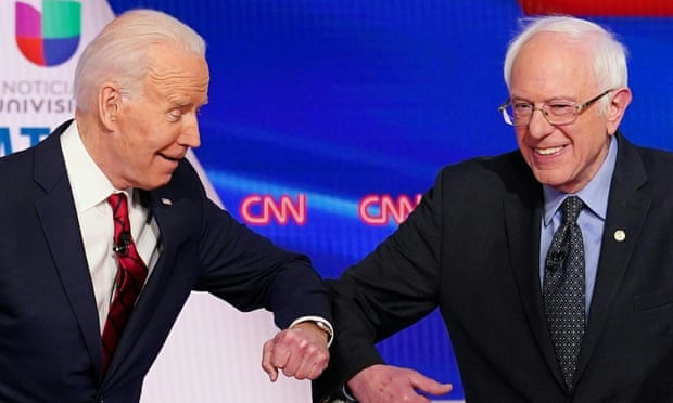 Joe Biden and Bernie Sanders greet each other with a safe elbow bump before the start of the 11th Democratic presidential debate on 15 March 2020.