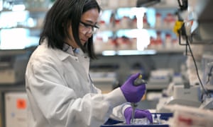 Scientist Xinhua Yan works in the lab at Moderna in Cambridge, MA.