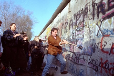Locals destroy the Berlin Wall in November 1989