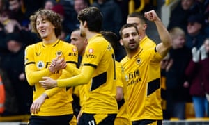 Wolverhampton Wanderers’ Jonny celebrates scoring their first goal with teammates.