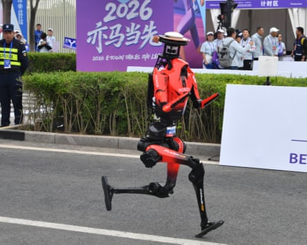 A humanoid robot running along a street
