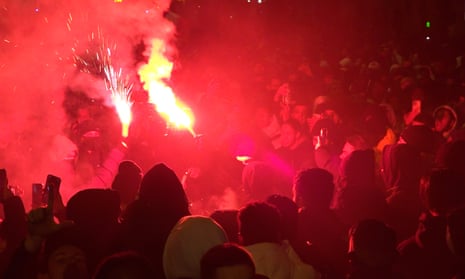 Fans of France celebrate victory over Morocco in the Champs Elysées in Paris