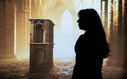 A silhouette of a woman in front of a 3D digital reconstruction of a medieval shrine