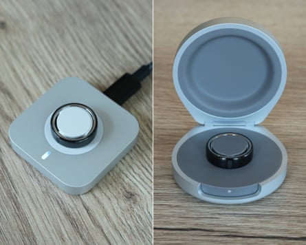 The Oura Ring 5 on a charging dock or a charging case.