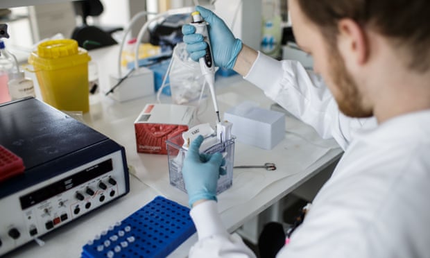A researcher works on a Covid-19 vaccine at Copenhagen University. 