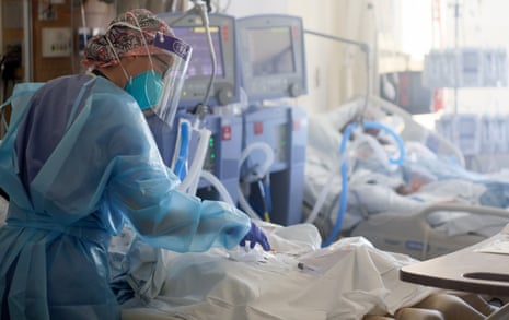 A nurse cares for patients in the Covid-19 intensive care unit at Harbor-UCLA medical center in Torrance, California. 