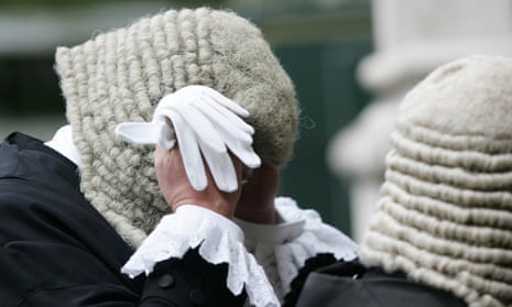 A Judge adjusts his wig as he arrives at Westminster Abbey