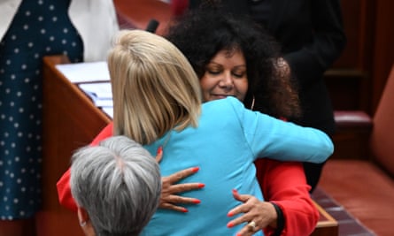 Labor senator Malarndirri McCarthy hugs Minister for Finance Katy Gallagher after the vote on the Territory Rights Bill in the Senate chamber at Parliament House in Canberra, Thursday, December 1, 2022. (AAP Image/Mick Tsikas) NO ARCHIVING