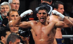 Amir Khan celebrates after dismantling Andreas Kotelnik to take the WBA light-welterweight title in 2009.