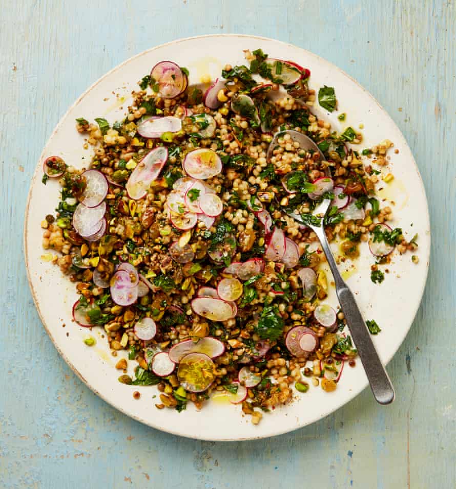 Yotam Ottolenghi’s giant couscous with herbs pistachios and spicy raisin dressing.